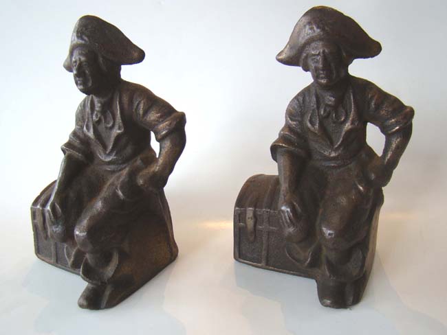 A pair of "Pirate Sitting on a Treaure Chest" cast iron bookends by Hubley circa 1915